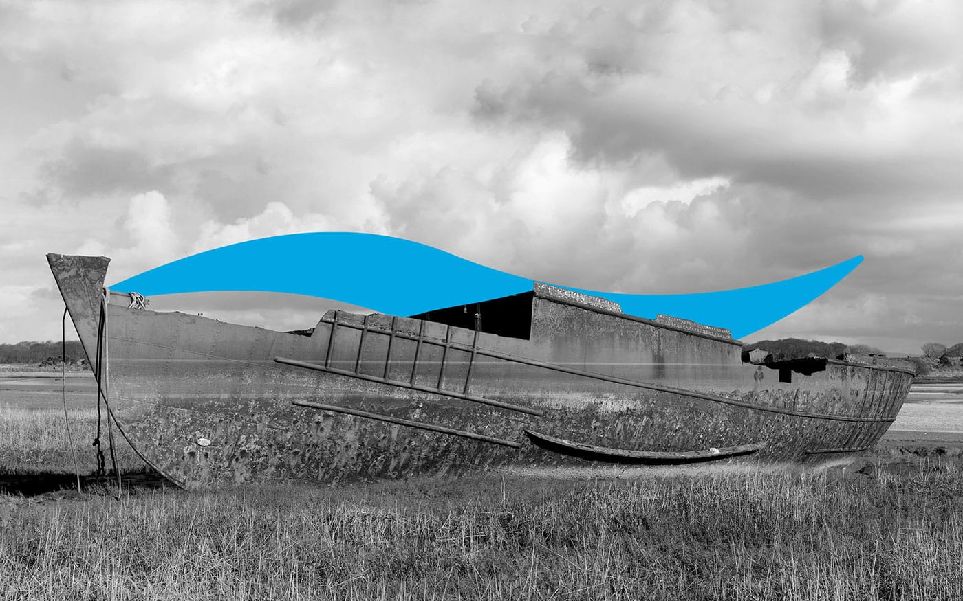 A monochrome image of an abandoned boat with stylized blue waves overlaying the scene, set against a cloudy sky.